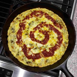 Cast Iron Pizza with Pesto, Red Pepper Puree, Gorgonzola Cheese and Pistachios!