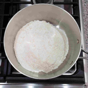 All purpose flour in an oven safe sauce pan, placed into a 500 degree oven.
