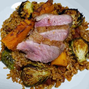 Paella with Seared Duck Breast, Candy Roaster Squash, and Brussels Sprouts
