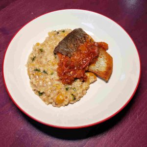 Peach Risotto with Goat Cheese and Basil topped with Pan Seared Trout and Tomato Chutney