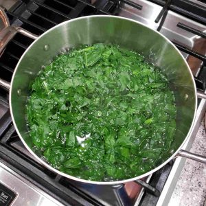 Blanch the kale in salted water for two minutes.