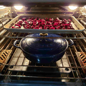 Cover the braiser and transfer to the oven, along with the beets on the baking tray.