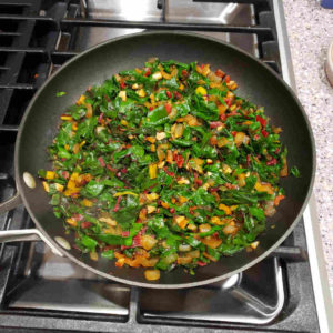 After just a few minutes, a whole 12 oz bunch of chard will fit into the pan.
