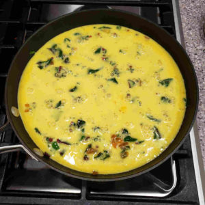 Beat the eggs and cream together and pour over the vegetable mixture.