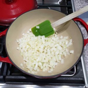 Sauté diced onion in olive oil until soft and translucent.