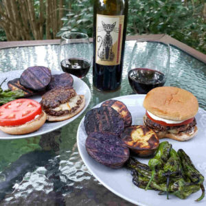 Grilled Blackberry Potatoes along with smash burgers and shishito peppers