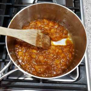 You know it's done cooking when you can expose a path in the bottom of the pan and the chutney doesn't flow back into the gap.