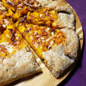 Savory Galette with Candy Roaster Squash, Caramelized Onions and Hickory Grove Cheese.
