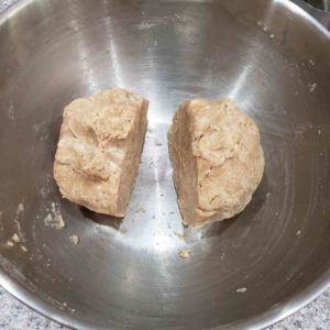 Split the dough into two equal pieces.