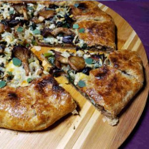 Savory Galette with Oyster and Shiitake Mushrooms, Red Russian Kale and Hickory Grove Cheese.