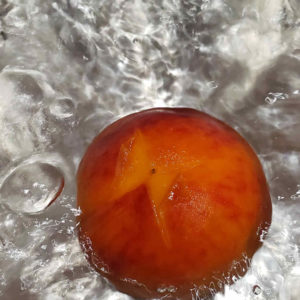 peach in boiling water