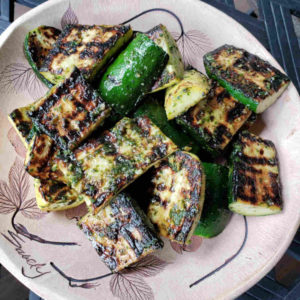 Charred Yellow Squash and Zucchini Tossed in Carrot Top Pesto