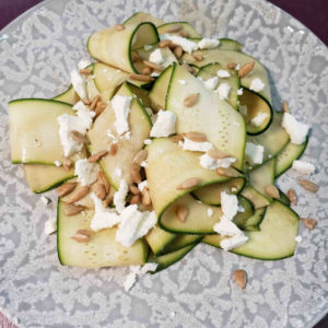 Shaved zucchini salad with chèvre and sunflower seeds.