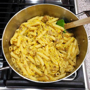 Cook a penne or other short pasta according to the package directions and combine it with the squash mixture.