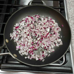 Dice a medium onion and sauté with a tablespoon of olive oil and half a teaspoon of salt until soft and translucent.