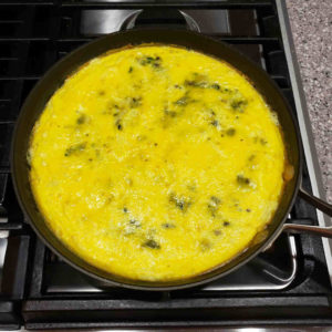 Top with melty cheese and put the skillet in the preheated oven.
