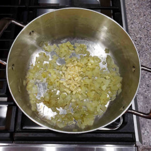 Sauté a medium diced onion with a teaspoon of salt and a tablespoon of olive oil. When softened and translucent, add 3-4 cloves of minced garlic and sauté  one more minute.