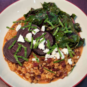 Beet Stem Risotto with Roasted Beets and Braised Beet Greens garnished with Chèvre and Mint