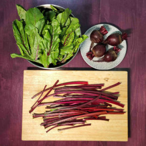 Beets with separated stems and greens