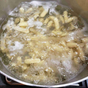 The water should return to a rolling boil. It only takes a few minutes to cook fresh pasta.