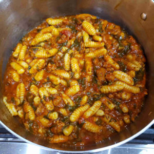 Here the cavatelli is added to an Italian sausage ragu with Swiss chard.