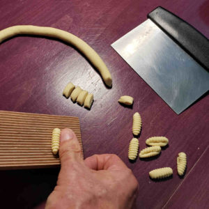 Shaping cavatelli.