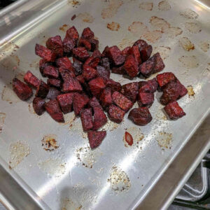 Remove the roasted beets from the oven. Reduce the temperature to 375°F.
